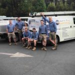 Team photo behind van-min Old switchboard with fuses